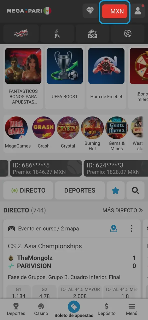 Portada móvil con el botón de moneda resaltado en la barra superior, sobre los carruseles de promociones y juegos.